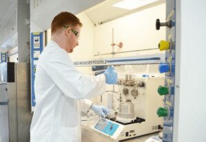 Scientist performing continuous flow chemistry, or continuous processing, in the labs