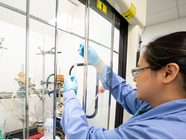 Scientist in Sterling labs using equipment used during radiochemistry projects