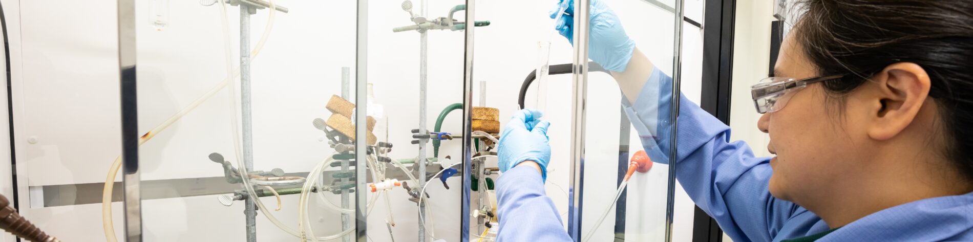 A scientist in the Sterling labs using equipment used within projects involving radiolabelling